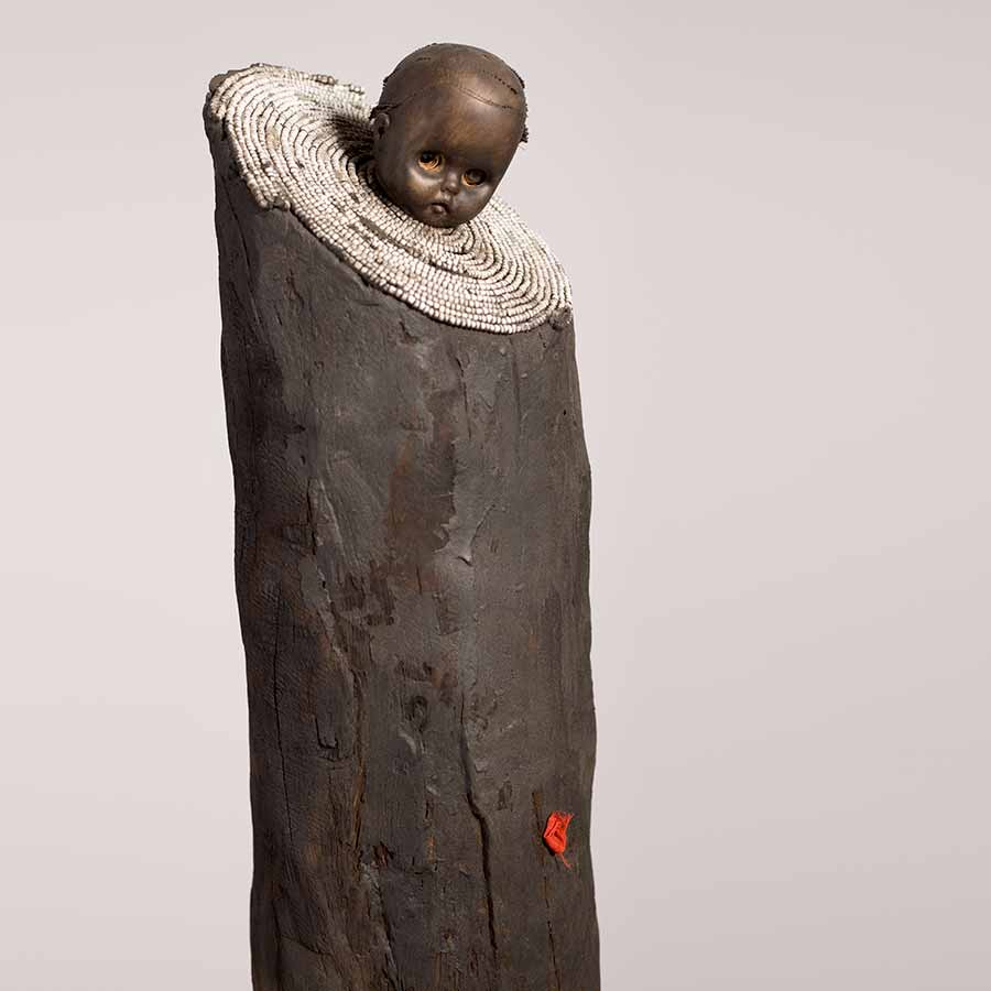 <strong>Gérard Quenum</strong>, <em>La bonne bergère (The Good Sheperdess)</em>, 2012.
Wood, metal, beads and plastic doll, 169 x 56  x 28 cm.