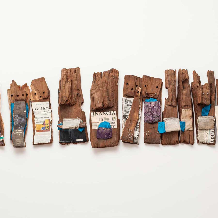 <strong>El Anatsui</strong>, <em>Well Informed Ancestors</em>, 1998. Tropical hardwoods and mixed media, 58 x 225 x 13 cm.