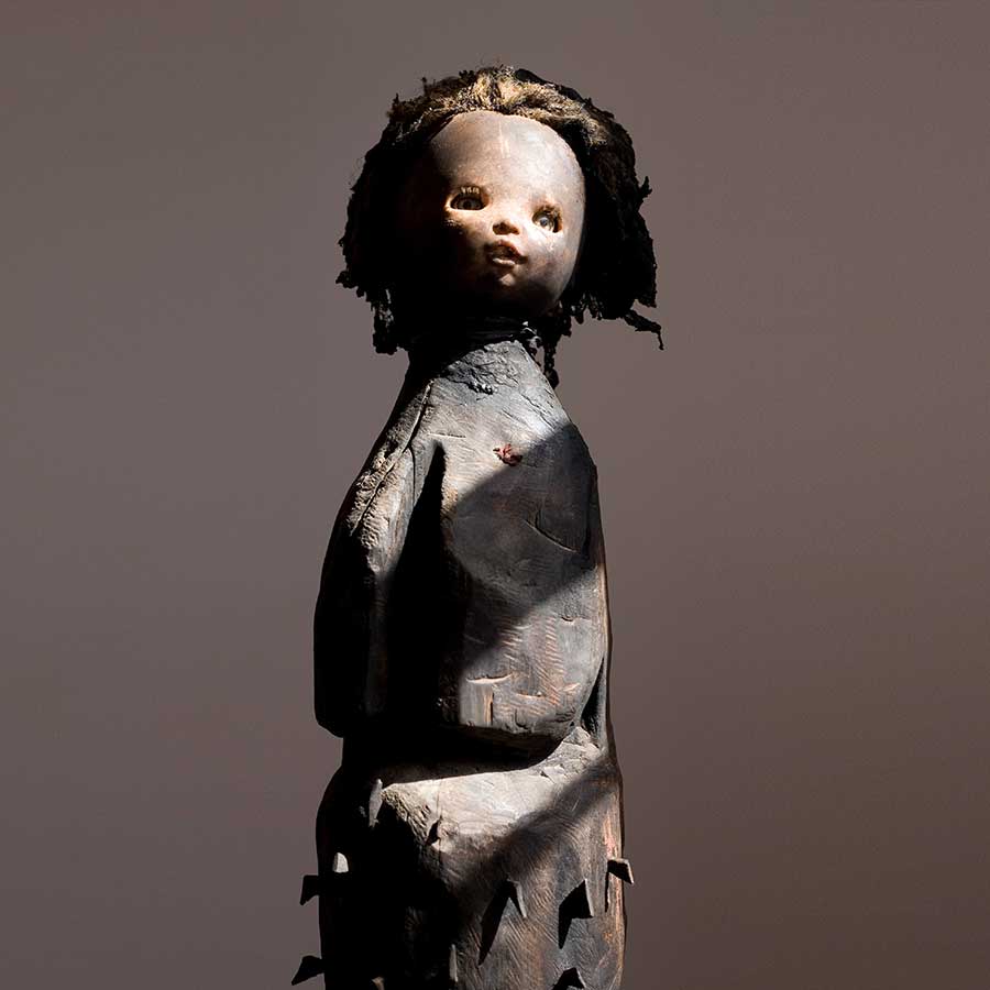 <strong>Gérard Quenum</strong>, <em>Mère du Secret (Mother of Secrets)</em>, 2008.<br>
Wood, doll, plastic and metal, 200 x 30cm.